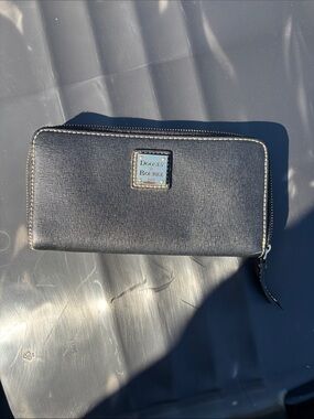 Dooney & Bourke Black Saffiano Zip Wallet with Gold Plaque